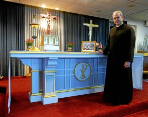 The Rev. Jason Kulczynski, Holy Martyrs pastor, stands by the altar used by Pope Francis during his visit to Philadelphia. Bob Raines--Montgomery Media